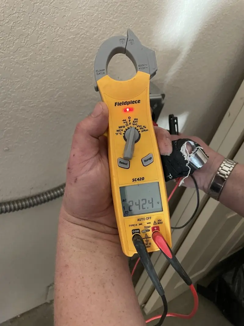 Voltage testing with clamp meter during Outlet Installation in Johnston City